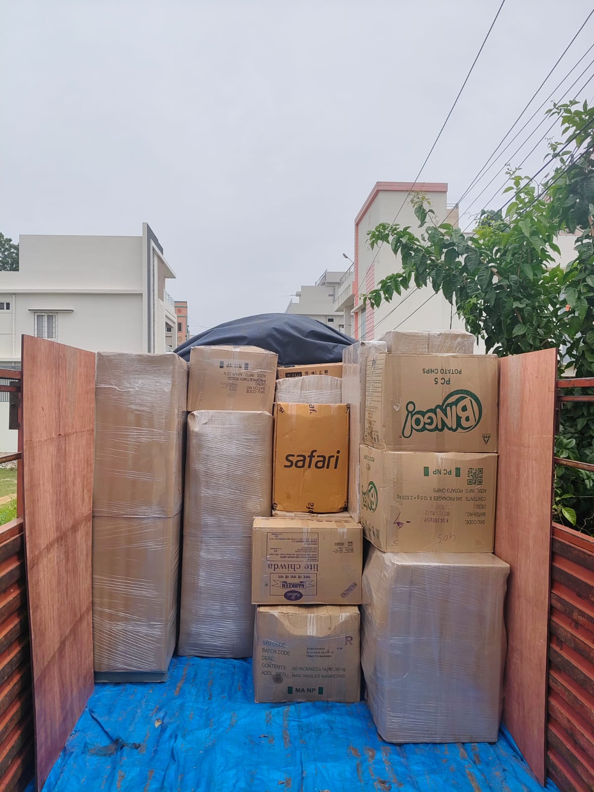 Furniture wrapped in protective quilted covers