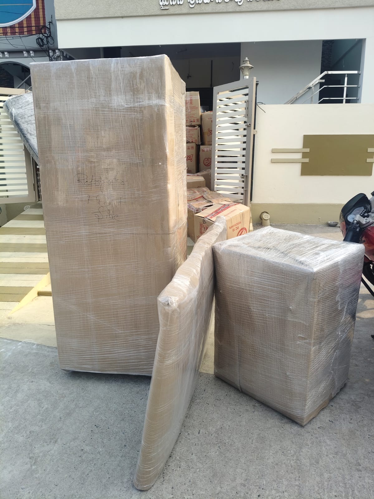 Sri Rama Packers crew loading securely wrapped furniture onto a truck